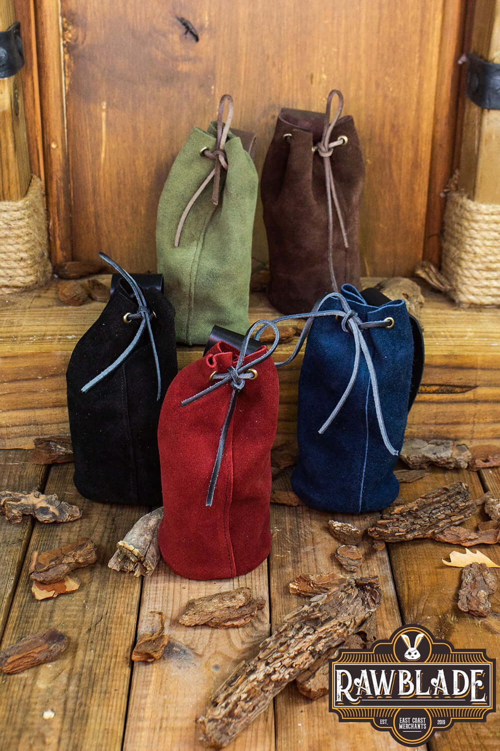 Adventurer Tube Pouch in multiple colors displayed on wooden surface, perfect for carrying various items for adventurers.