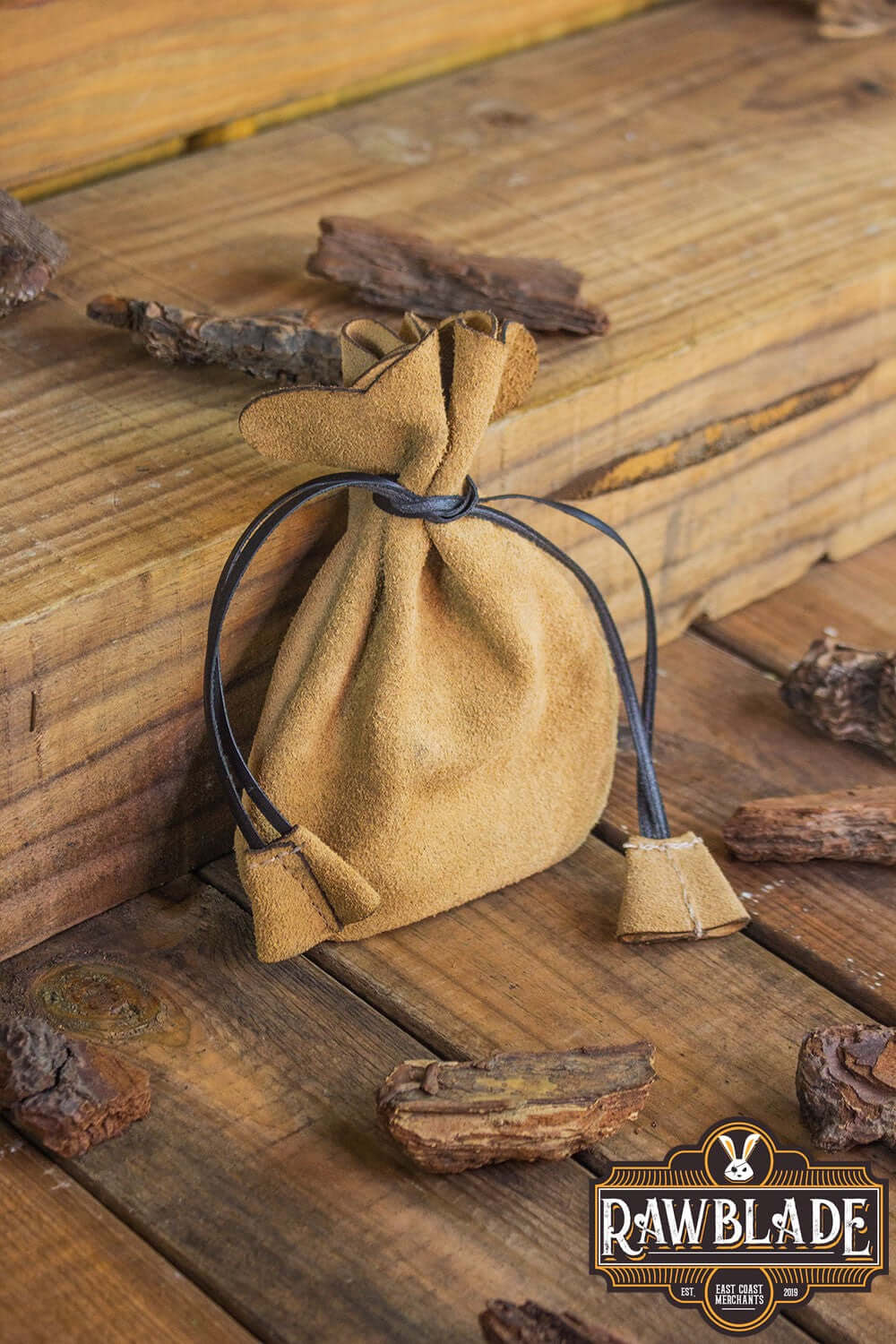 Alentorn Coin Bag made of soft split leather with leather drawstrings, perfect for carrying precious items.