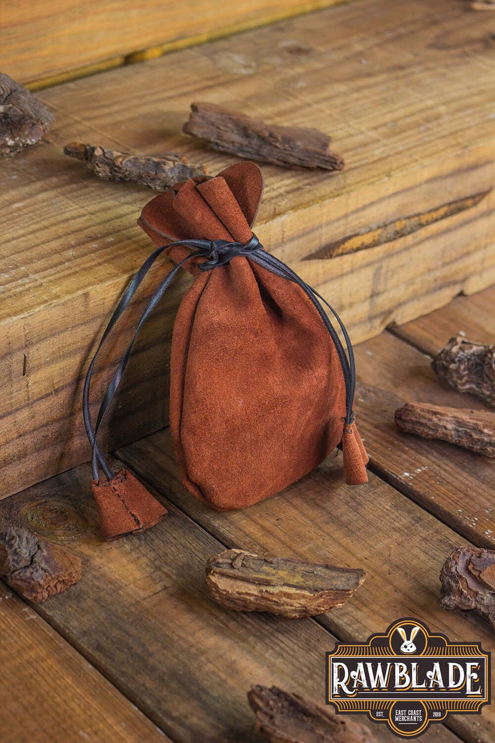 Alentorn Coin Bag made of soft split leather with drawstrings, perfect for storing valuables.