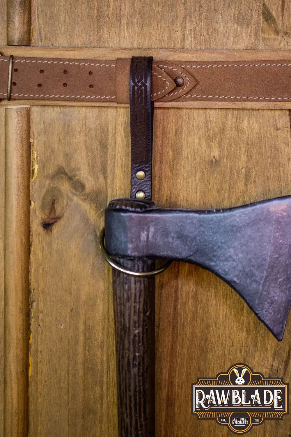 Runar Ring Holder featuring a sturdy leather strap and gold rivets, ideal for securing axes and maces.