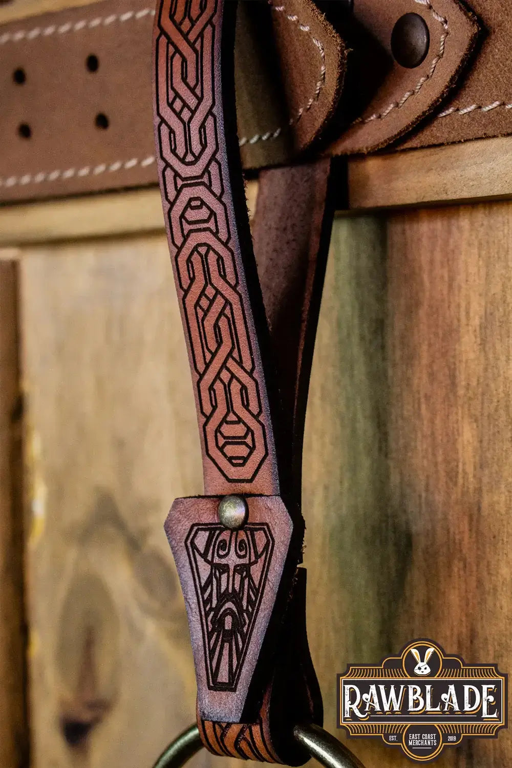 Bormund Ring Holder detail featuring intricate laser engraving on leather strap.