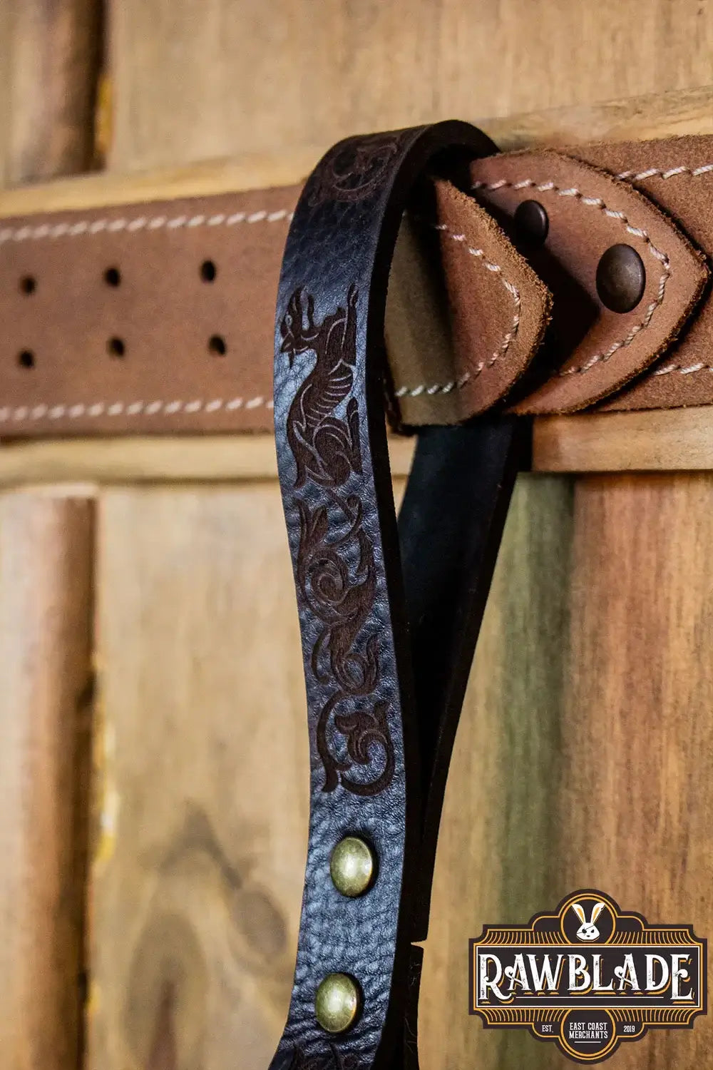 Aquitania Ring Holder with ornate laser engraving and gold rivets on leather belt