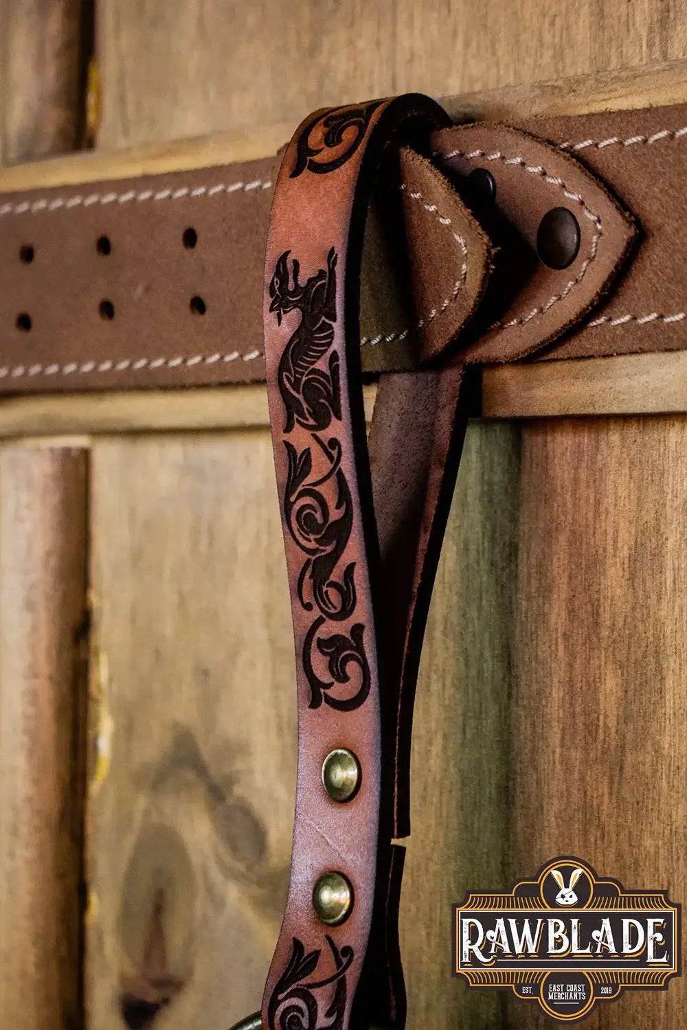 Aquitania Ring Holder featuring ornate laser engravings and gold rivets on leather, ideal for maces and axes.