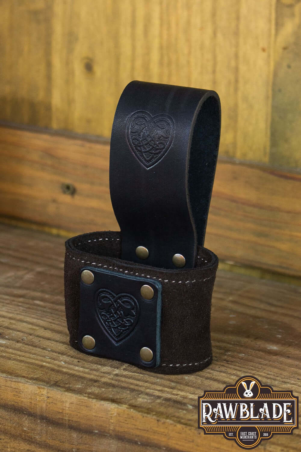 Wanderer Holder made from engraved leather with Celtic designs, featuring stitched borders and rivets.