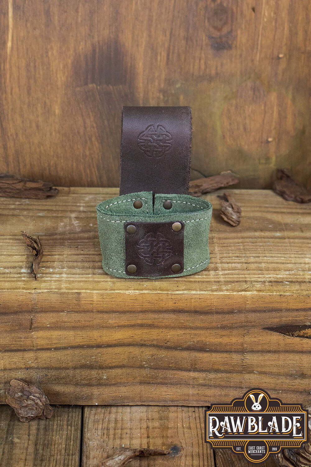 Wanderer Holder featuring high-quality split leather with Celtic designs and old gold rivets, from Rawblade.