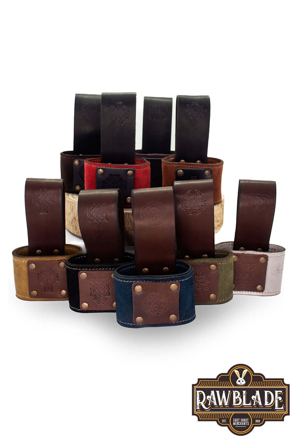 Various Wanderer Holders from Rawblade featuring engraved leather and Celtic designs.