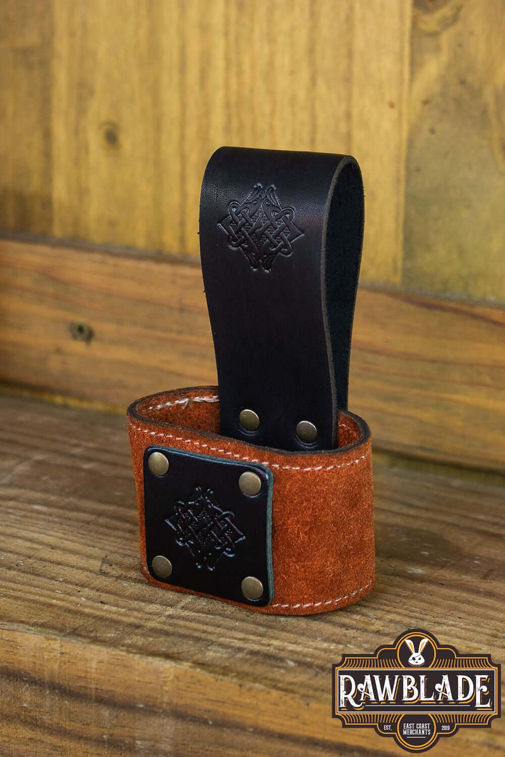 Wanderer Holder featuring engraved leather with Celtic designs and old gold rivets by Rawblade.