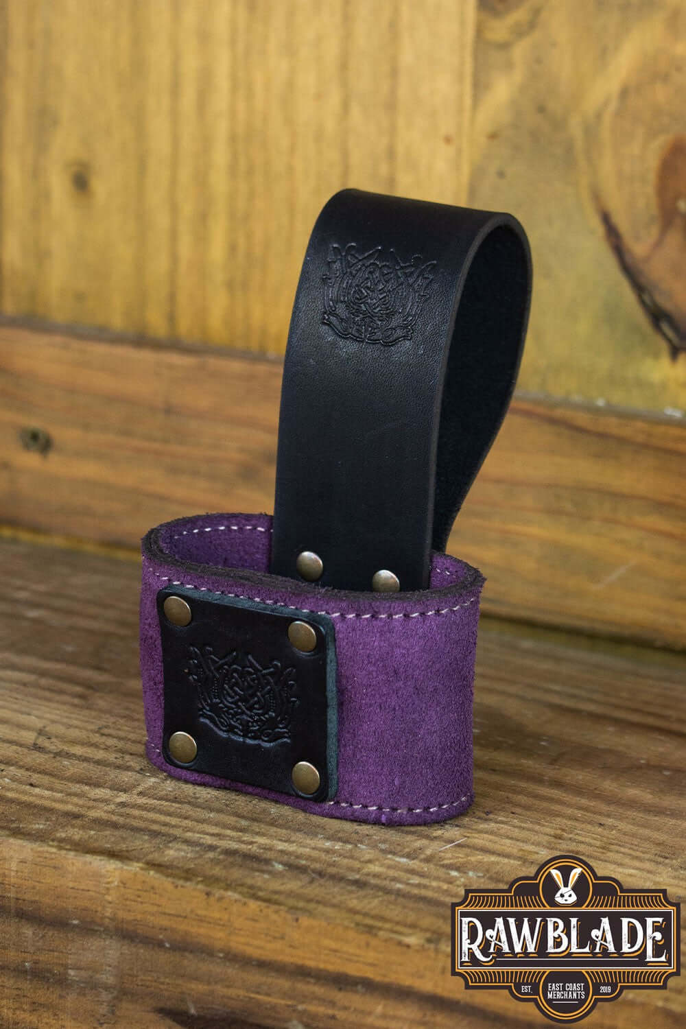 Wanderer Holder made of high-quality split leather with Celtic designs and old gold rivets, measuring 9cm width by 12cm height.