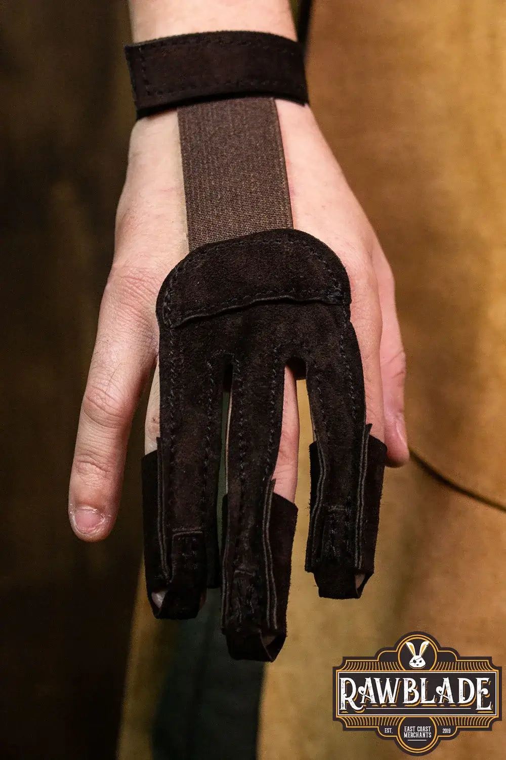 Archery Glove Kane shown on a hand, made of high quality split leather, adjustable wrist with velcro.