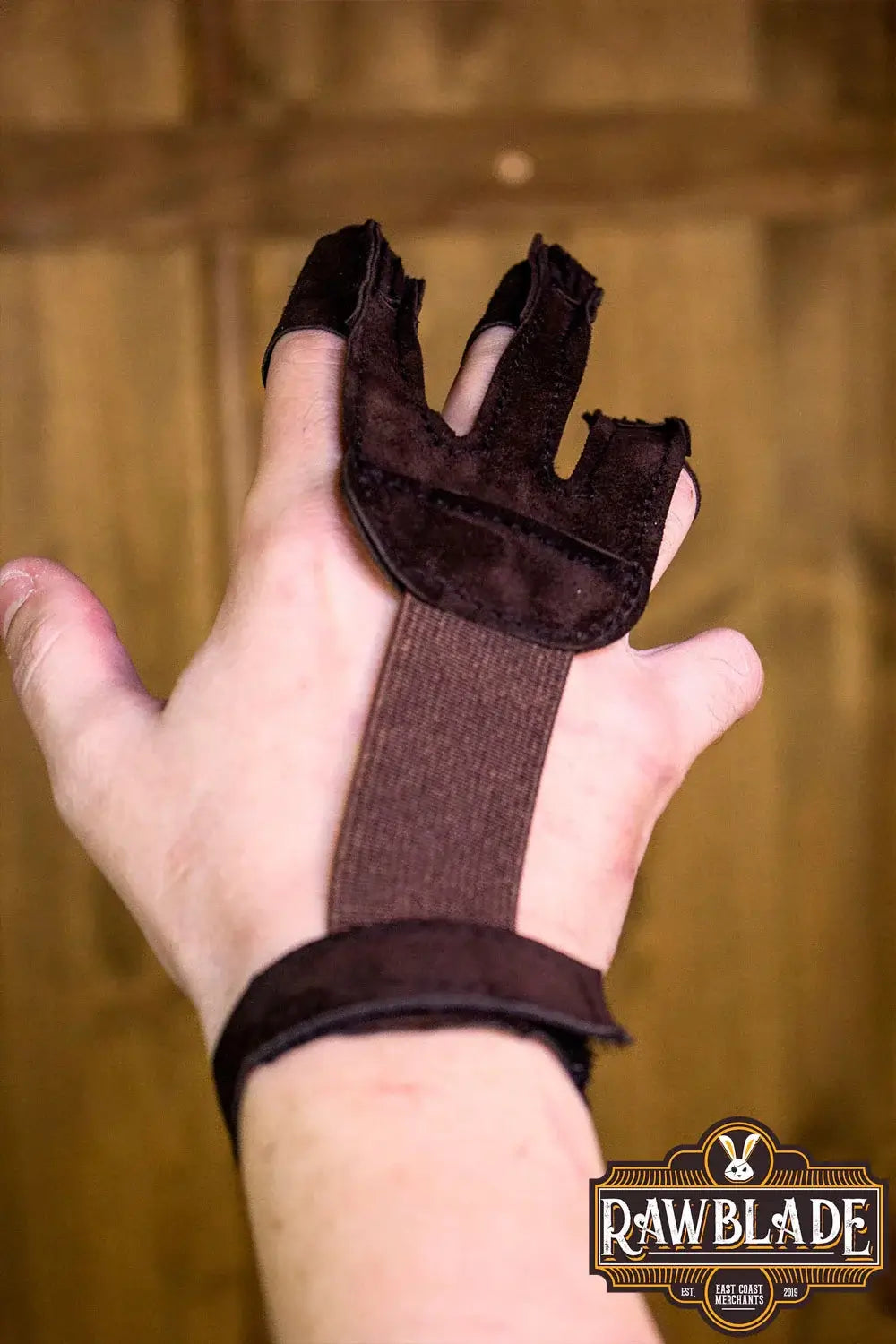 Archery Glove Kane shown on a hand, featuring three finger design, adjustable wrist strap, and high-quality split leather.