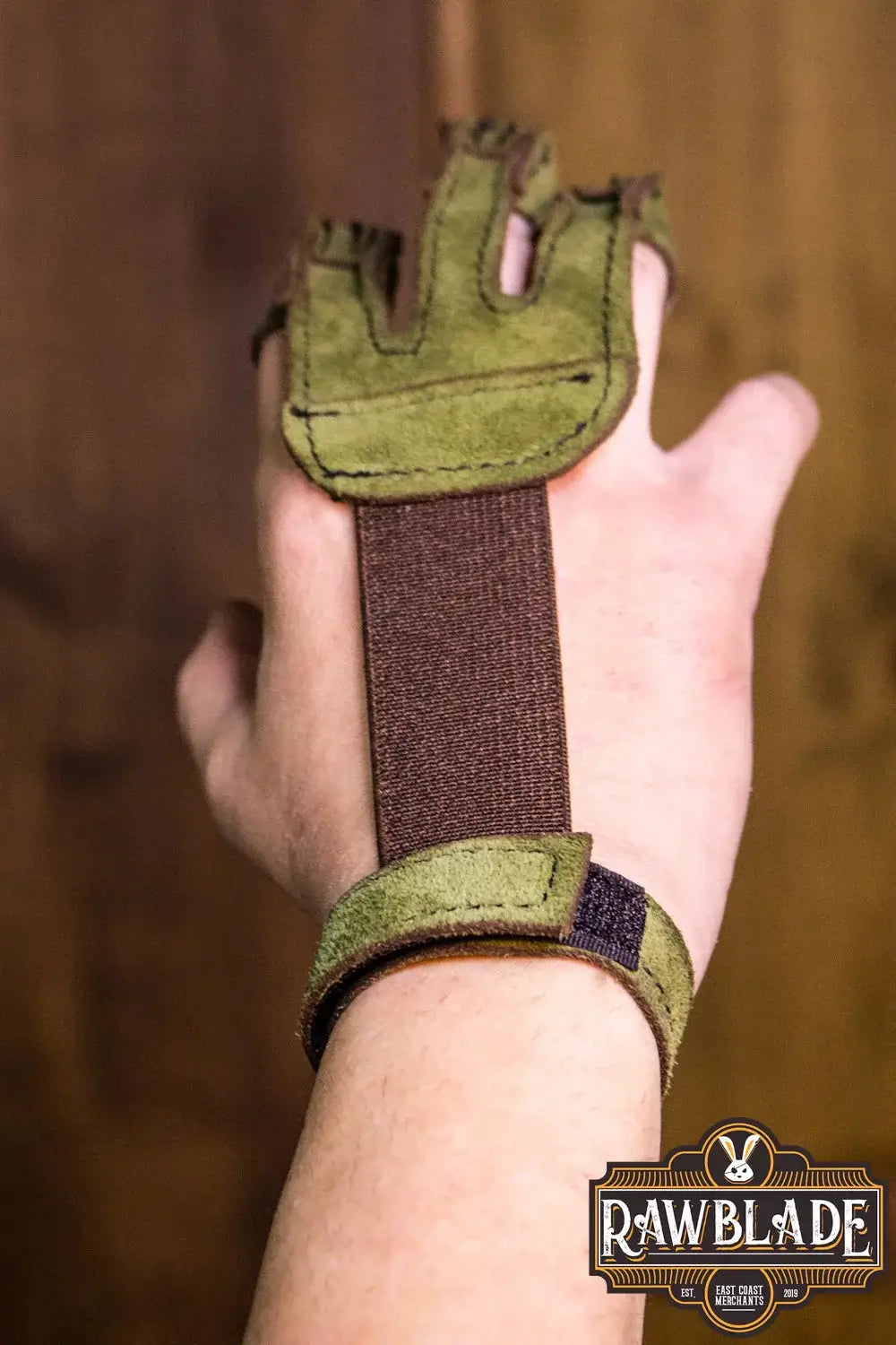 Archery Glove Kane worn on hand, showcasing the three-finger design and adjustable velcro wrist strap.