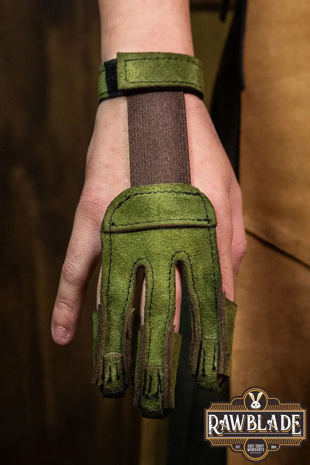 Archery Glove Kane in green color, featuring three fingers for hand protection and adjustable wrist strap.