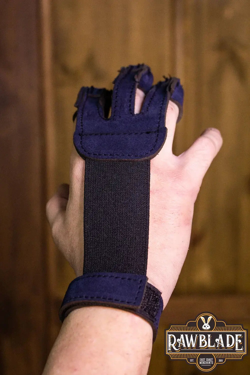 Archery Glove Kane displayed on a hand, featuring three fingers, velcro wrist adjustable strap, and split leather.