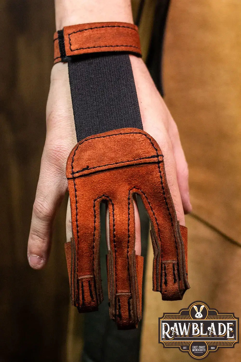 Archery Glove Kane shown in hand, made from high quality split leather, adjustable wrist with velcro.