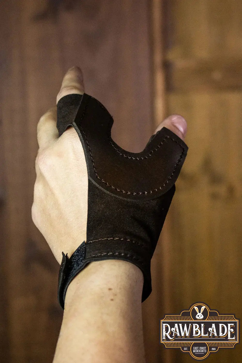 Archery Glove Oren shown on hand, showcasing high-quality leather and adjustable wrist strap.