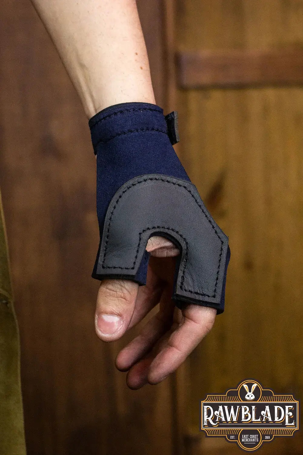 Archery Glove Oren shown on a hand, made of high quality split leather, perfect for bow hand protection.