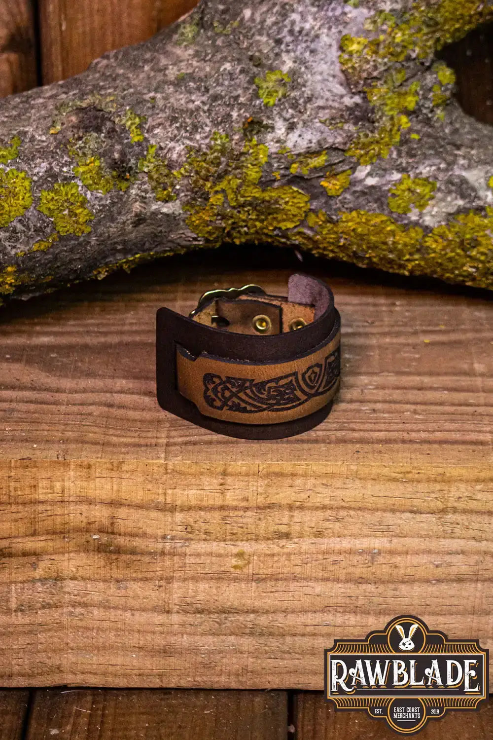 Aredel Leather Bracelet featuring two-tone leather with engraved filigrees and adjustable golden buckle.
