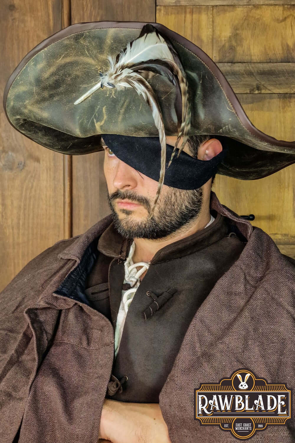 Man wearing Captain Teague Hat with Feathers, featuring a weathered design and feathers for pirate style.