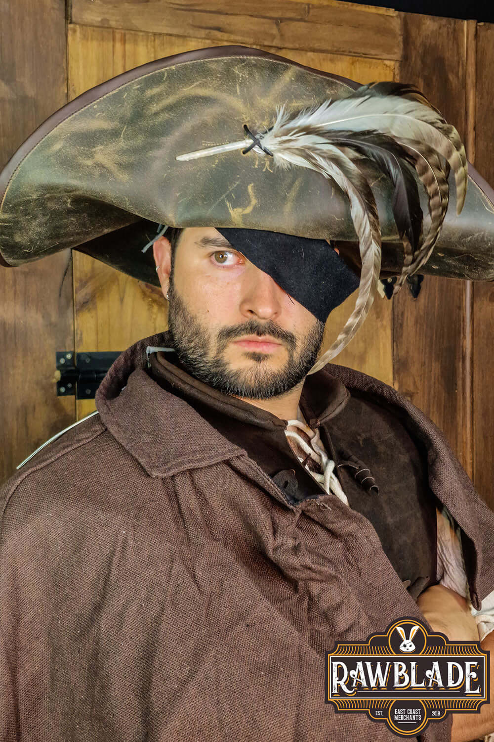 Captain Teague Hat with Feathers worn by a man in a pirate costume, featuring feather details.