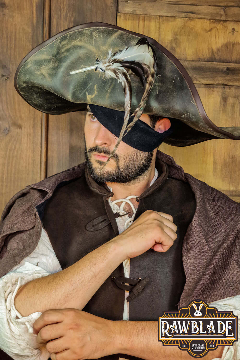 Captain Teague Hat with Feathers worn by a man, featuring a weathered look and feathers for authentic pirate style.