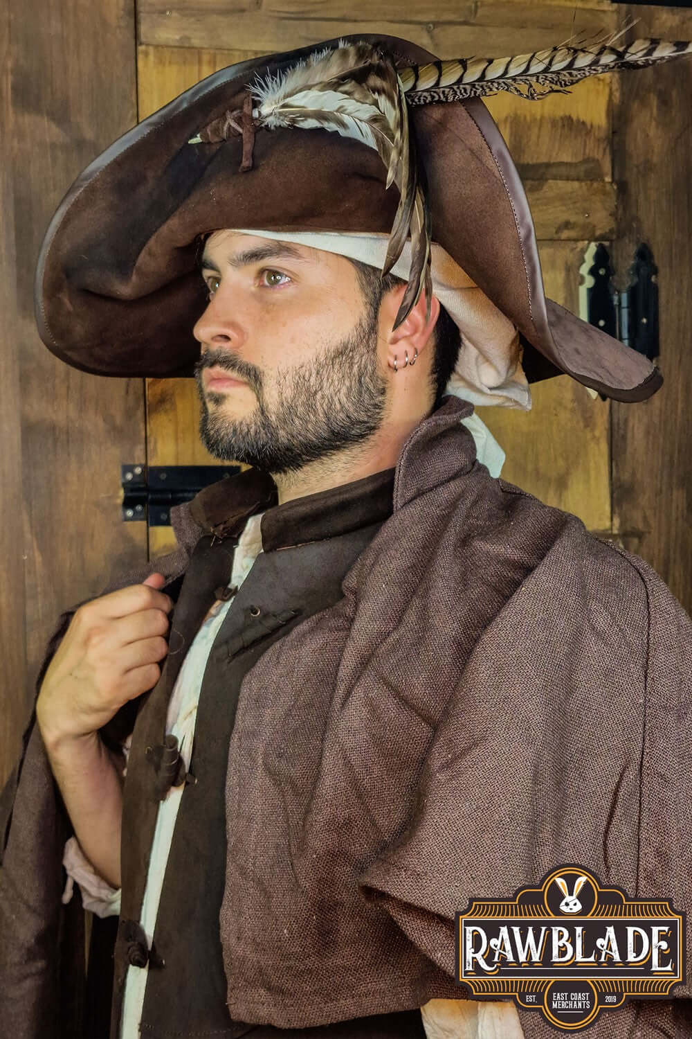 Man wearing Captain Teague Hat with Feathers from Rawblade, showcasing a pirate-inspired look with feathers.