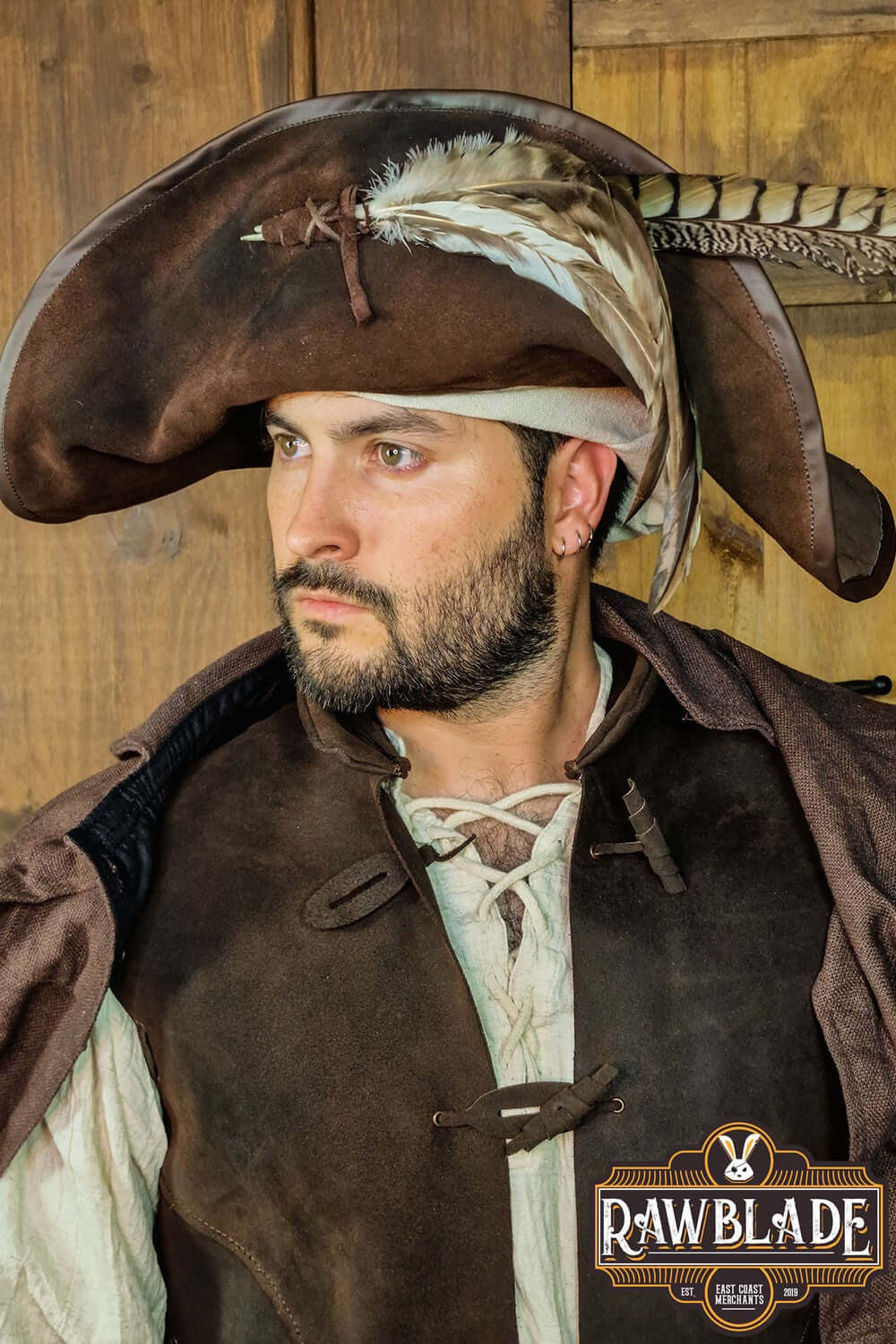 Captain Teague Hat with Feathers worn by a man, featuring a weathered design and authentic pirate style.