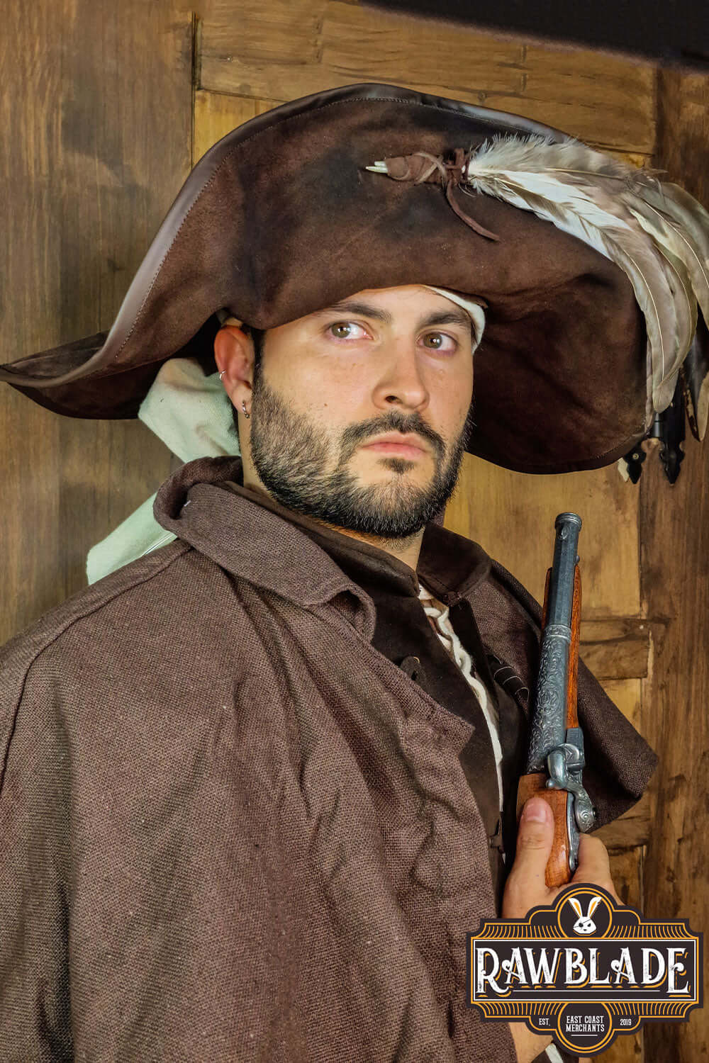 Captain Teague Hat with Feathers worn by a man, featuring a weathered look and feathers for pirate flair.