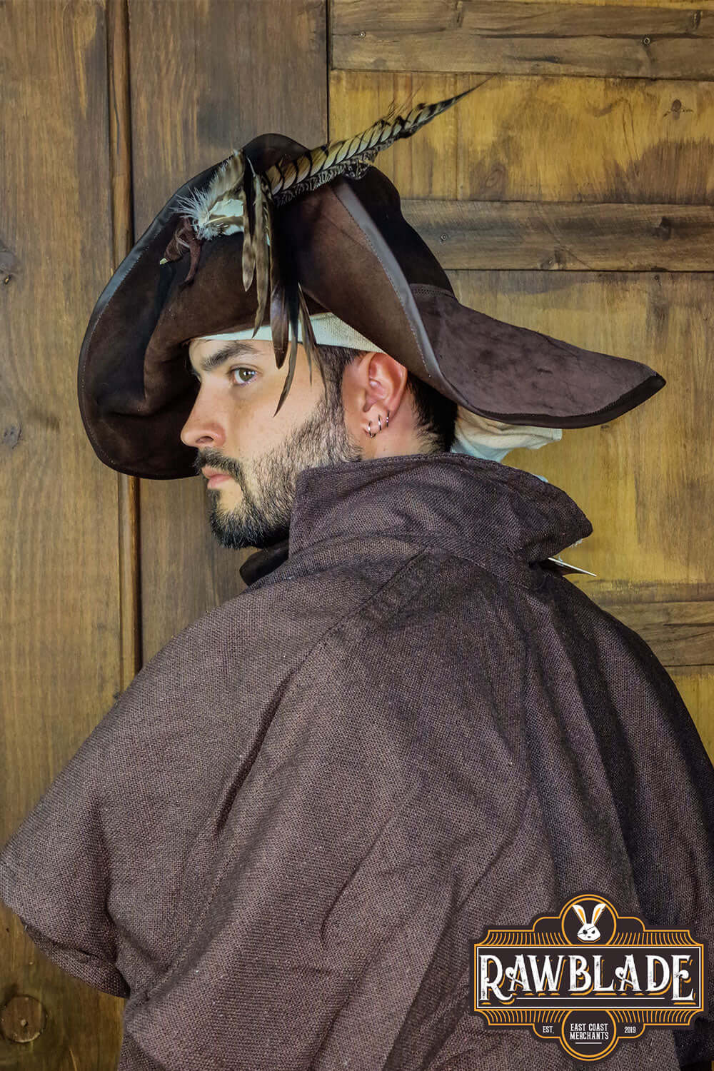 Captain Teague Hat with Feathers worn by a man showcasing its unique pirate style.
