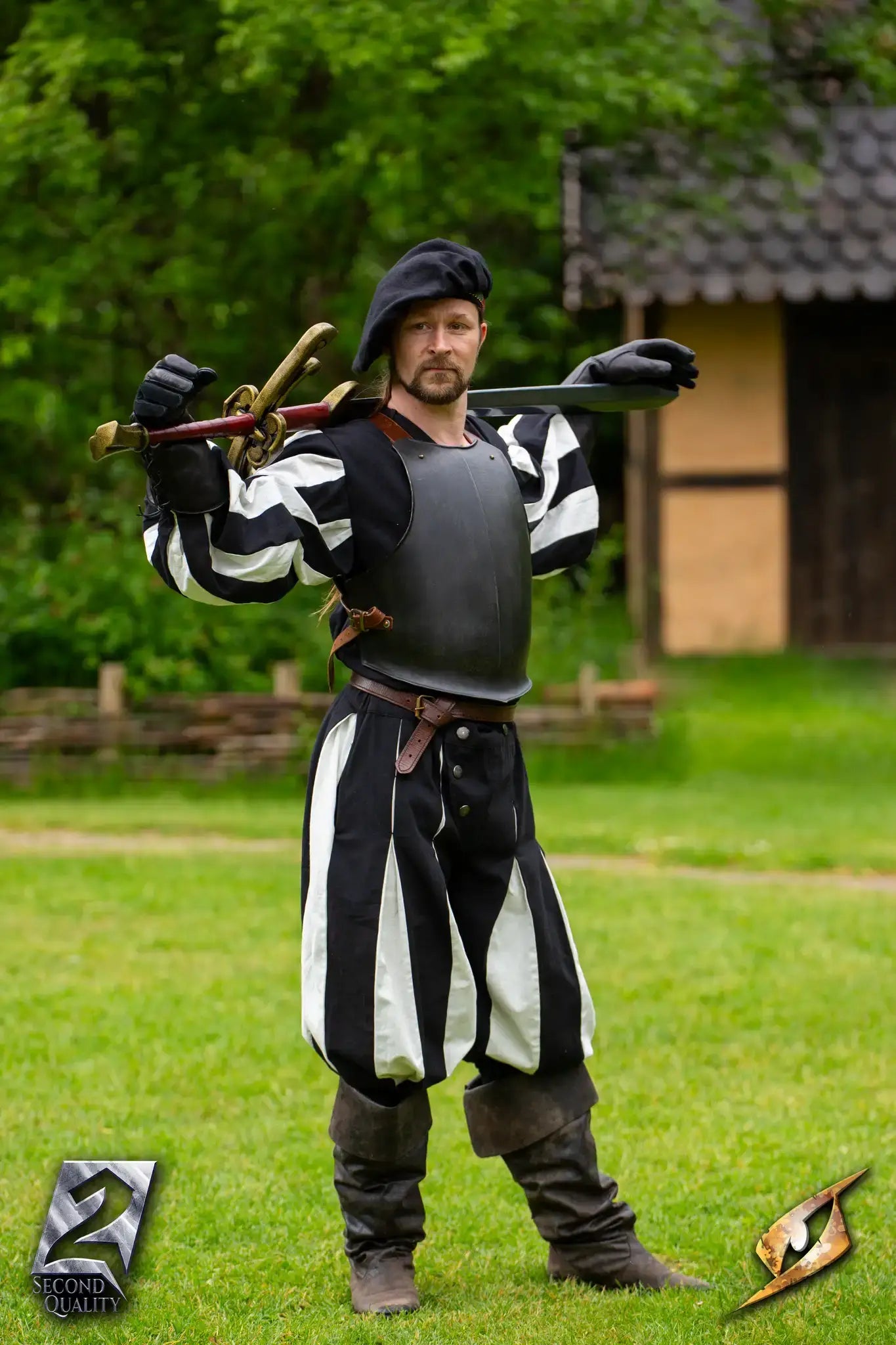 2nd Quality – Landsknecht Greatsword displayed by a man in Renaissance attire, showcasing historical craftsmanship.