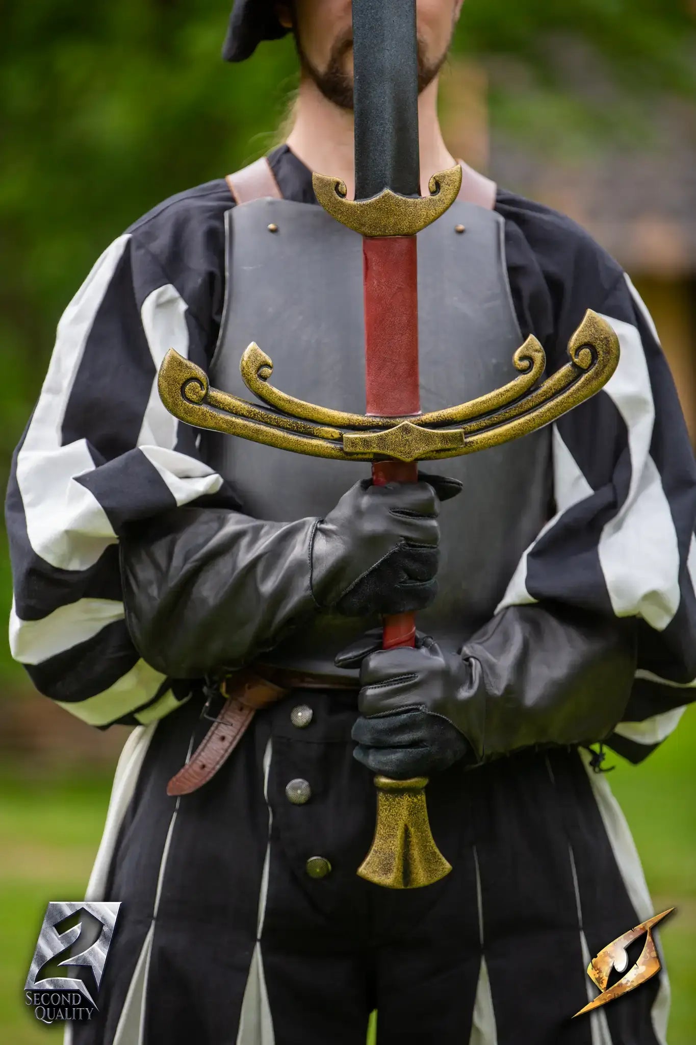 2nd Quality – Landsknecht Greatsword held by a person in historical costume, showcasing the sword's design and craftsmanship.