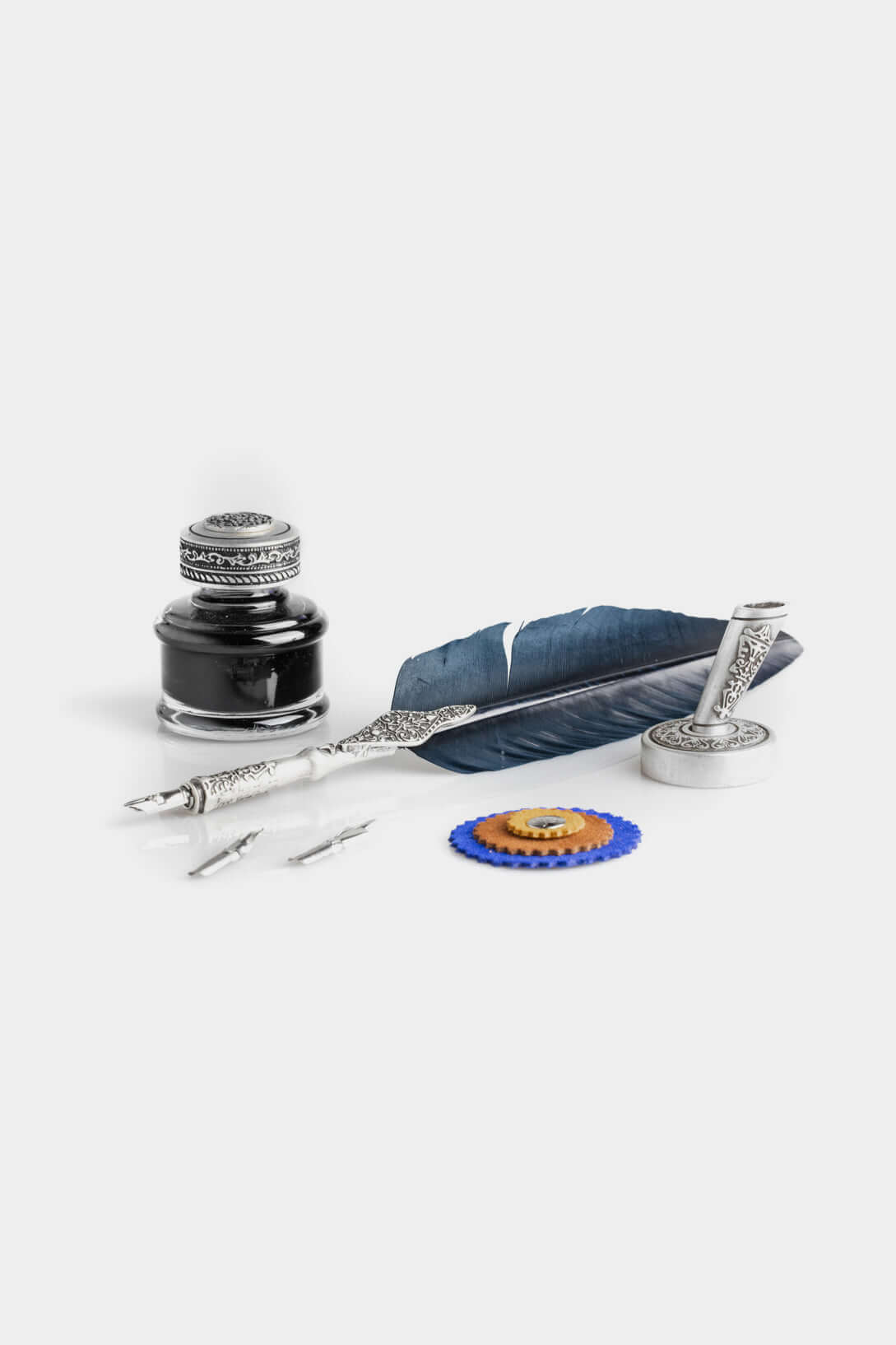 Calligraphic Writing Set featuring feather pen, inkwell, and spare nibs for elegant writing.