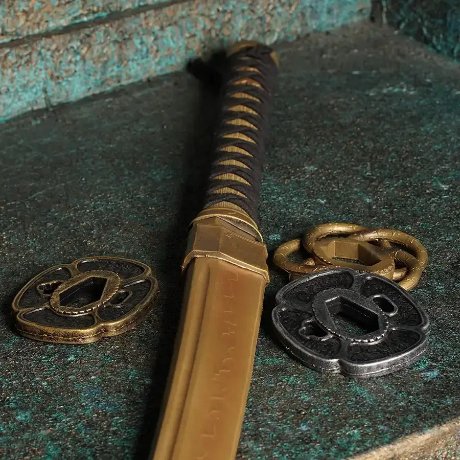 Close-up of a decorative sword with ornate tsuba, showcasing intricate designs on a textured surface.