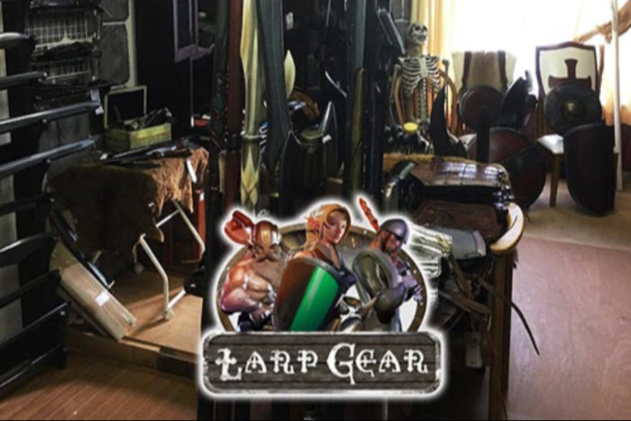 A display of LARP gear, featuring costumes, weapons, and props for live action role-playing enthusiasts.