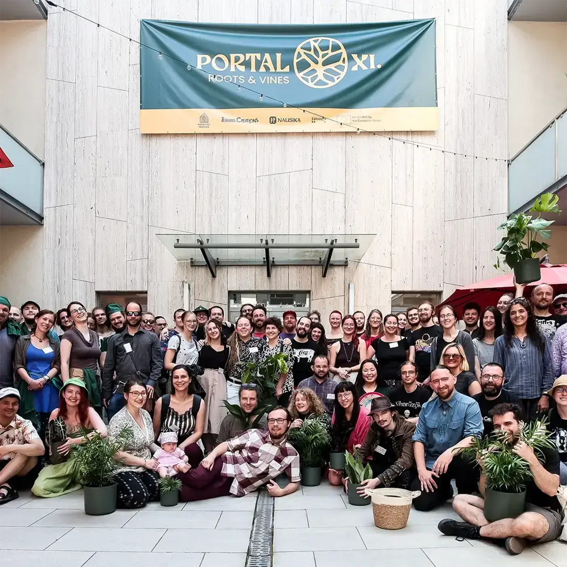 Group photo of attendees at Portal XI: Roots & Vines, showcasing community and connection.