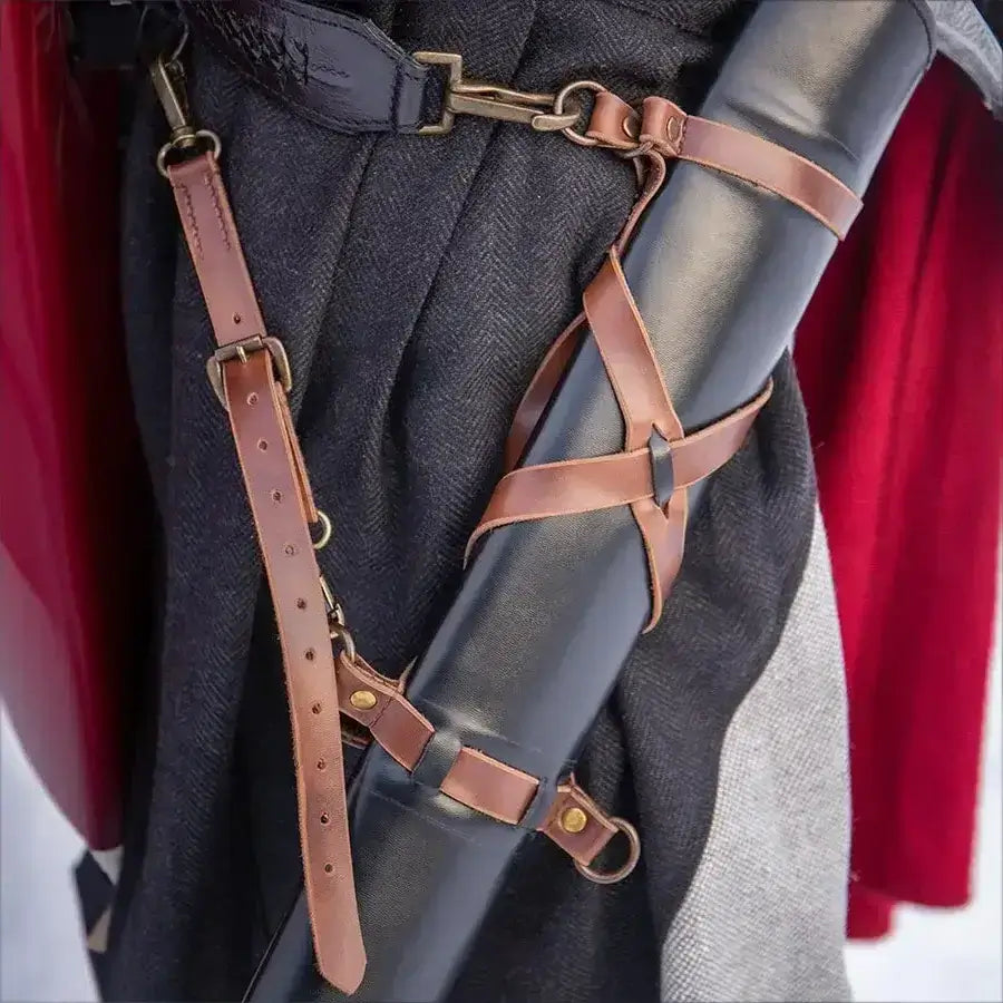 Close-up of a leather strap system securing a scroll tube, showcasing craftsmanship and stylish design.