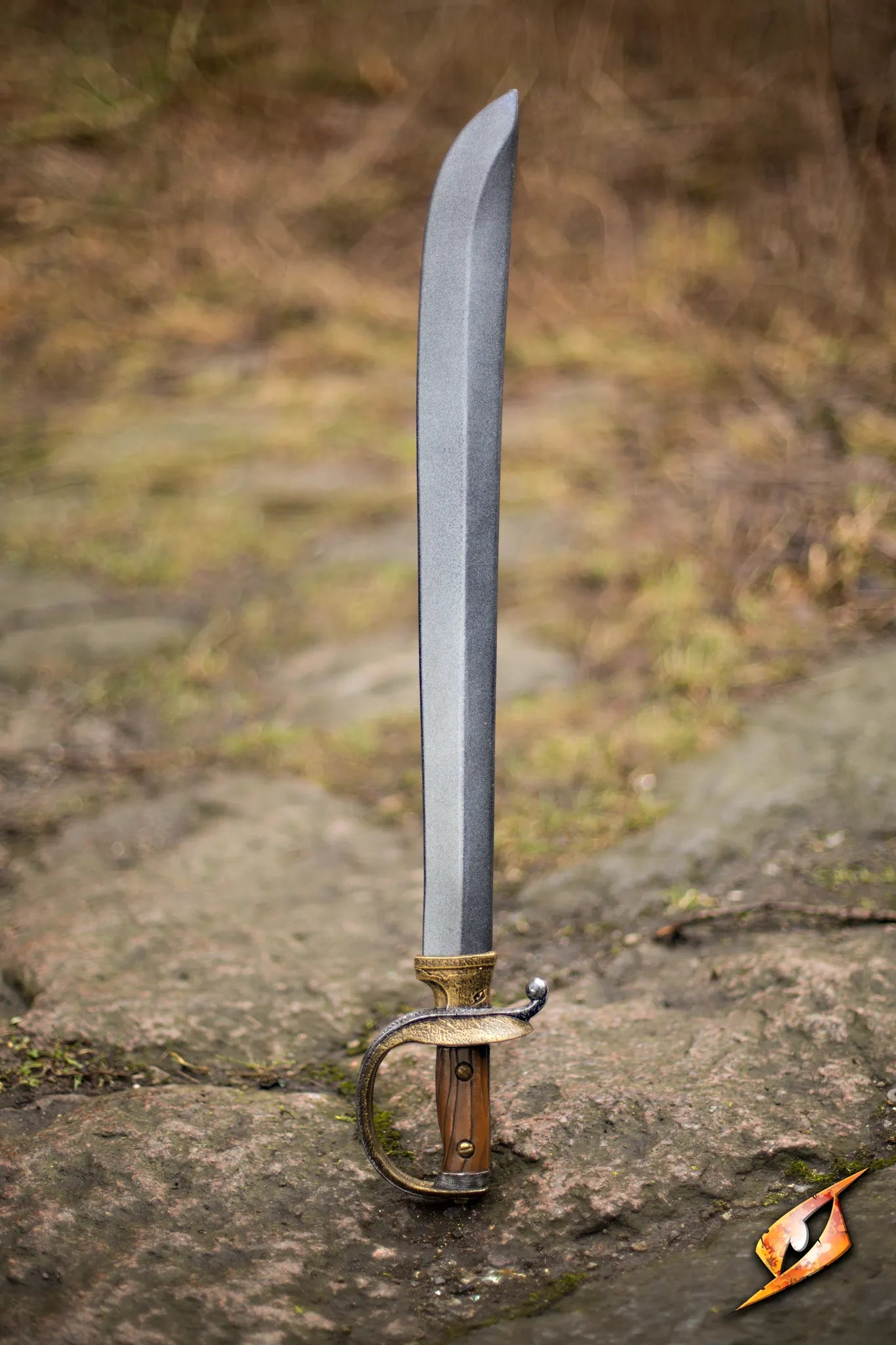 Cutlass displayed on a rocky surface, showcasing its sharp blade and ornate handle, ideal for any pirate enthusiast.