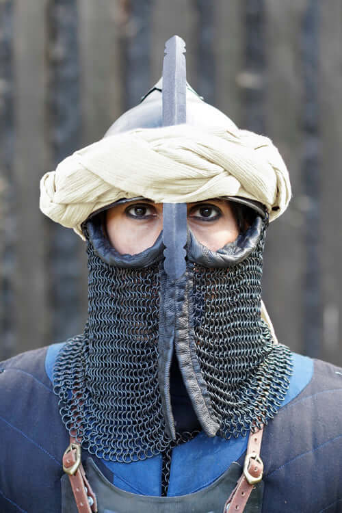 Helmets worn by a LARP participant, showcasing medieval style and attention to detail.