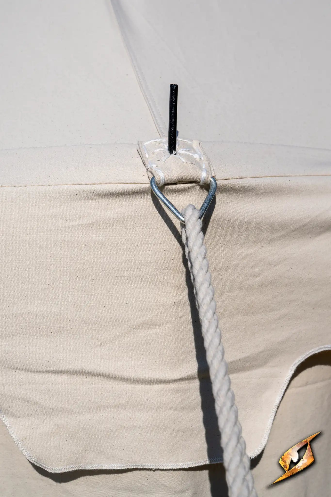 Marquee Tent - 4x6m with rope and peg securing the tent fabric for stability.