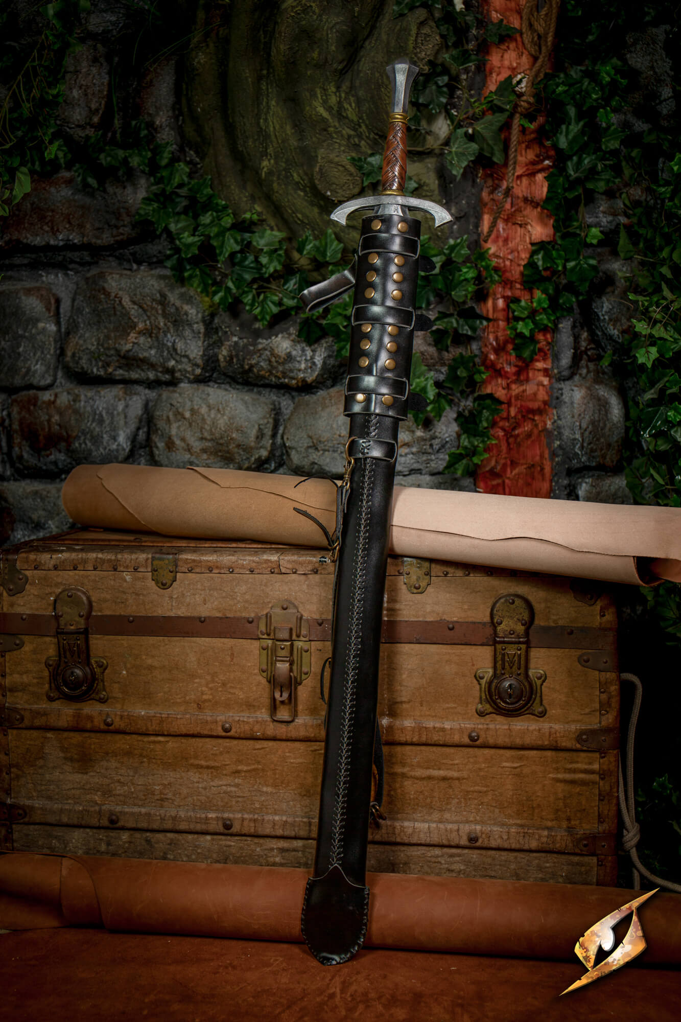 Adjustable Scabbard - Faux Leather displayed with a sword on an old trunk in a fantasy setting.