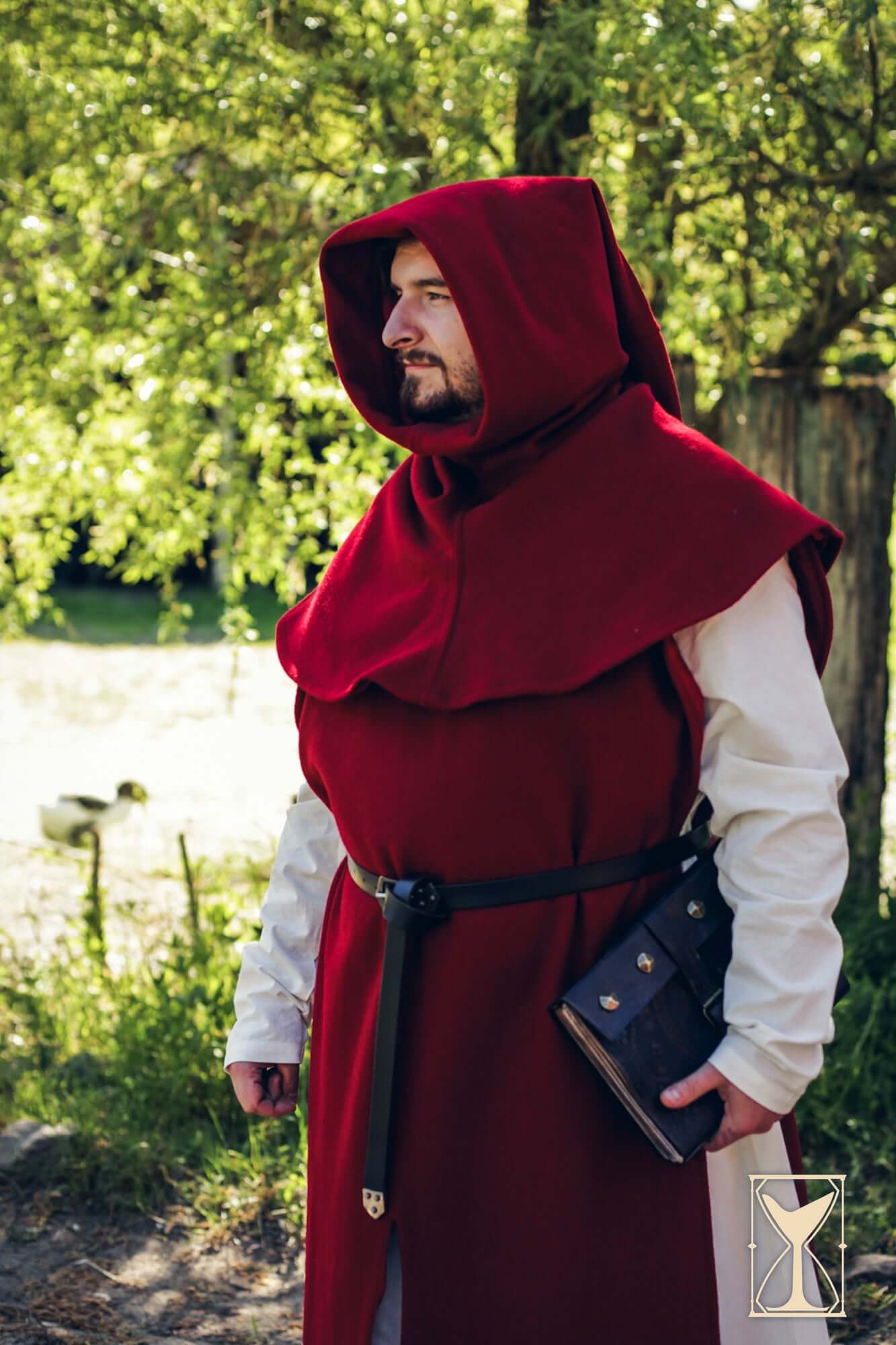 Simple Liripipe Hood - Brushed Wool worn by a man in a red medieval outfit outdoors.