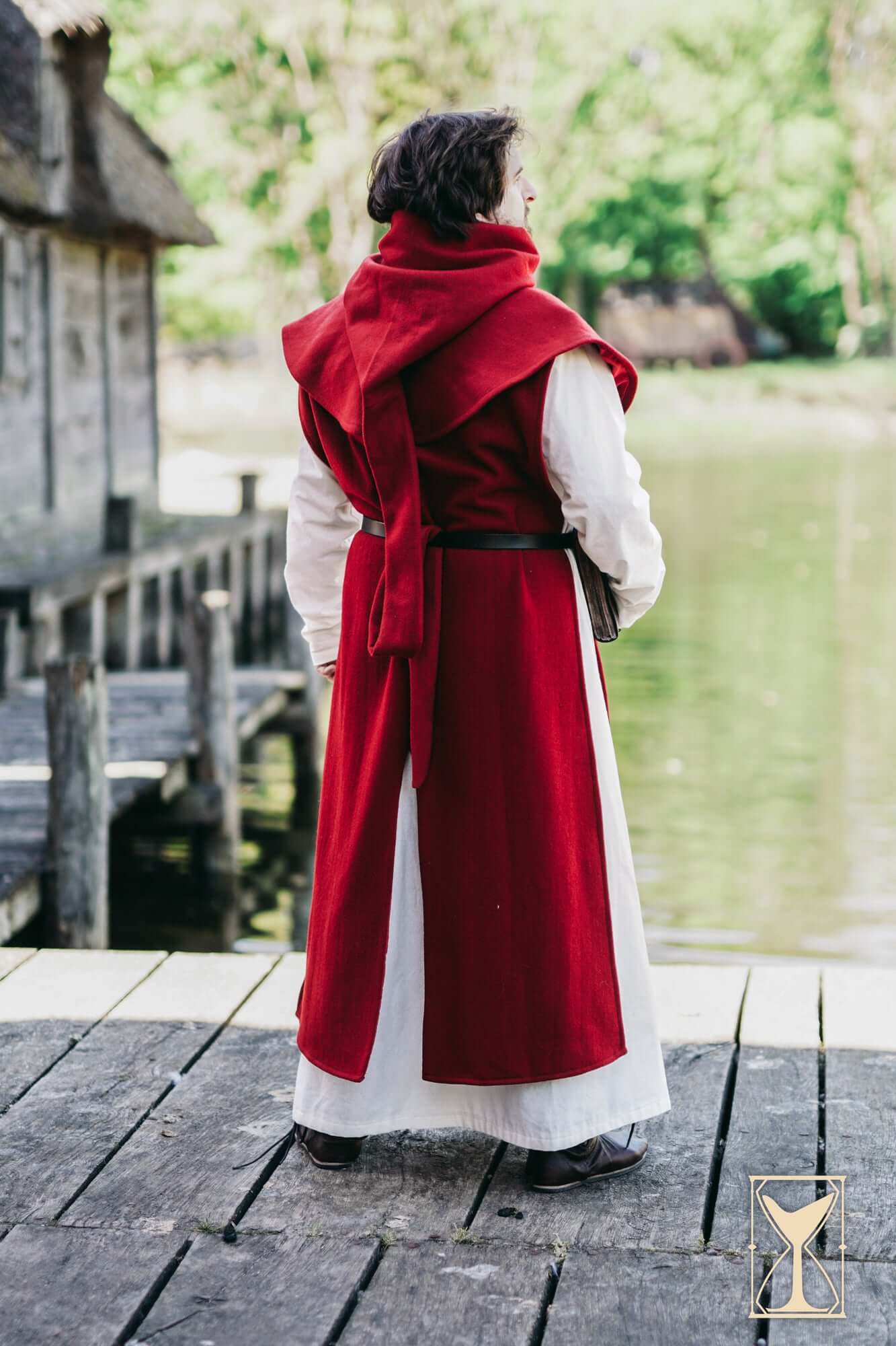 Simple Liripipe Hood - Brushed Wool worn by a person by the water in a medieval setting.