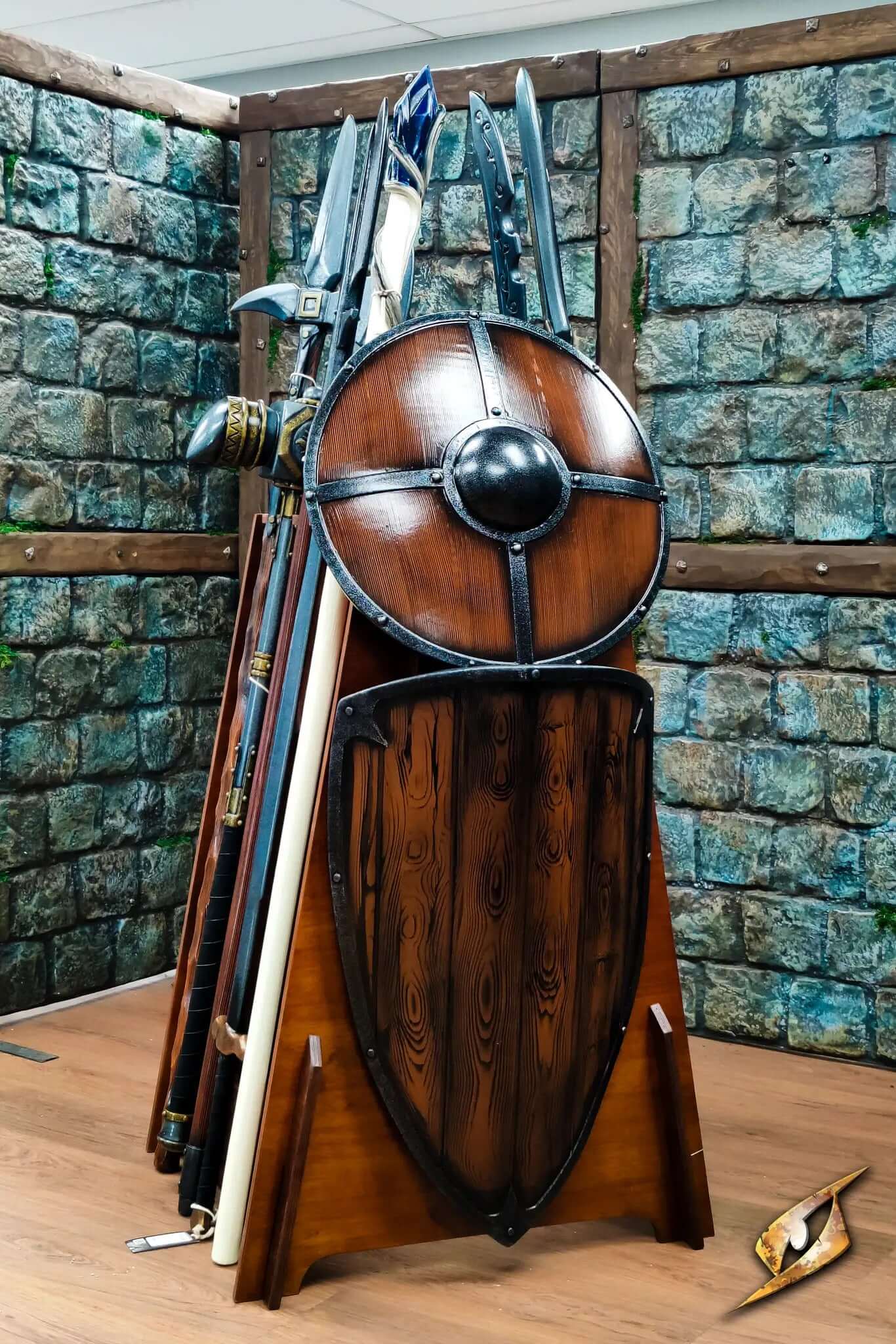 Polearms Rack displaying various weapons including a shield, greatswords, and polearms in a rustic setting.