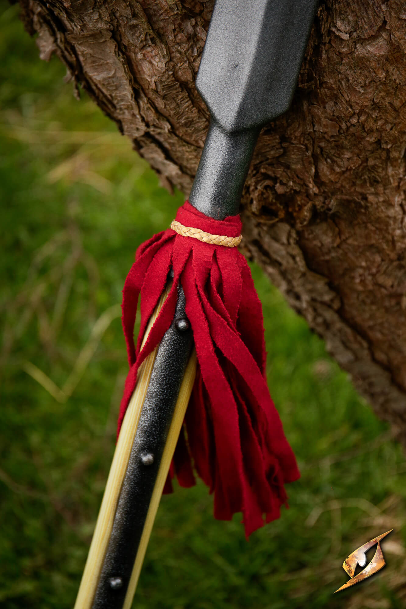 Close-up of a Landsknecht Pike showing the red tassel on its shaft, highlighting craftsmanship and historical design.