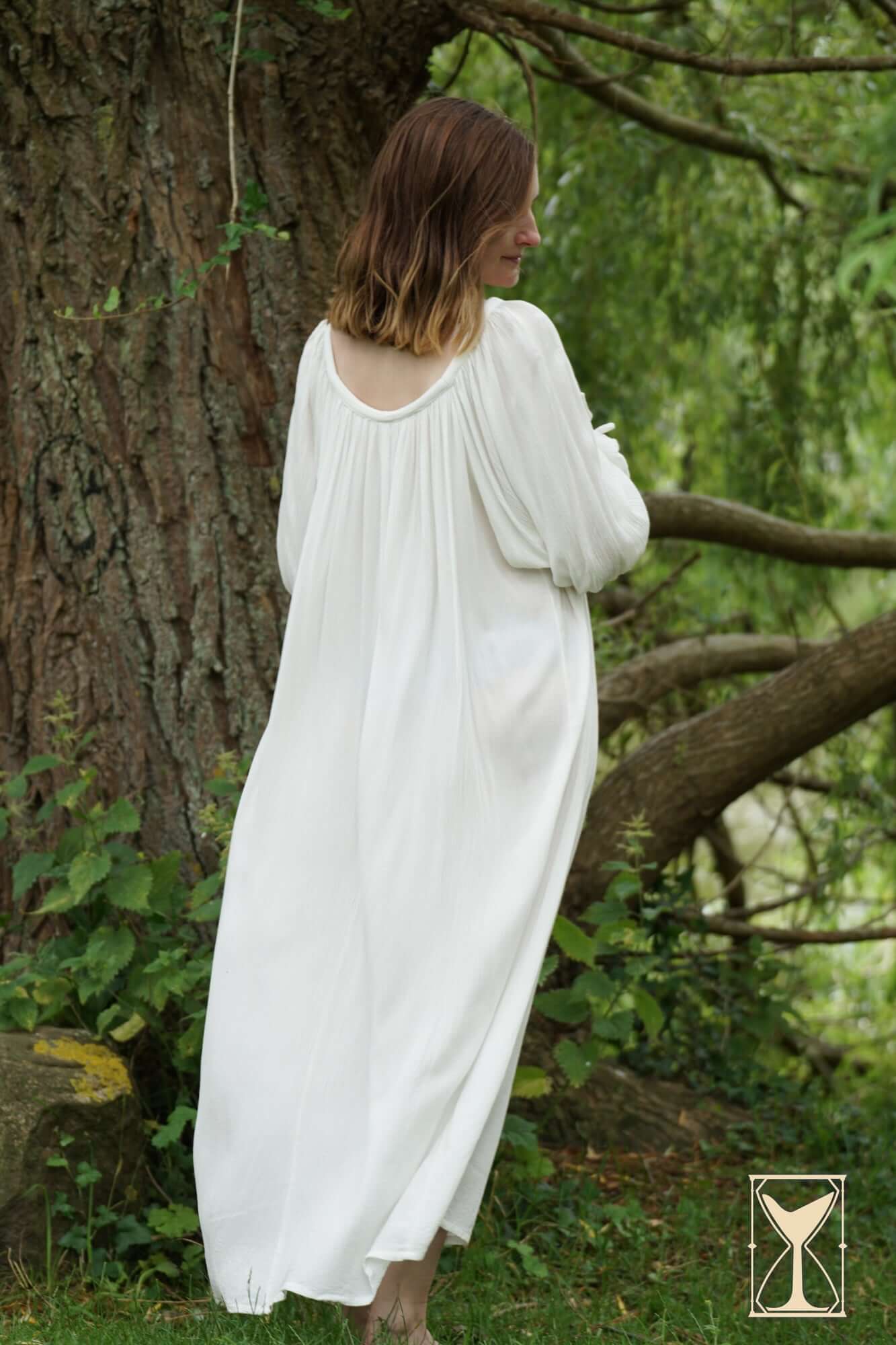 Shift Giulia historical costume dress worn outdoors, featuring a soft white fabric and delicate design.