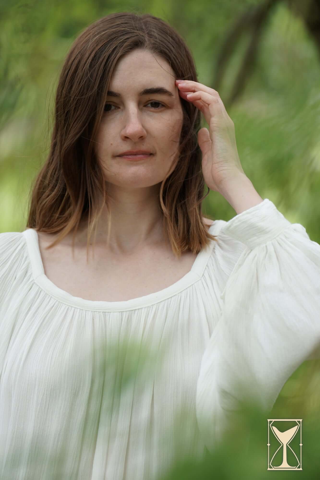 Shift Giulia worn by a model in a natural setting, showcasing its historical costuming design and fabric.