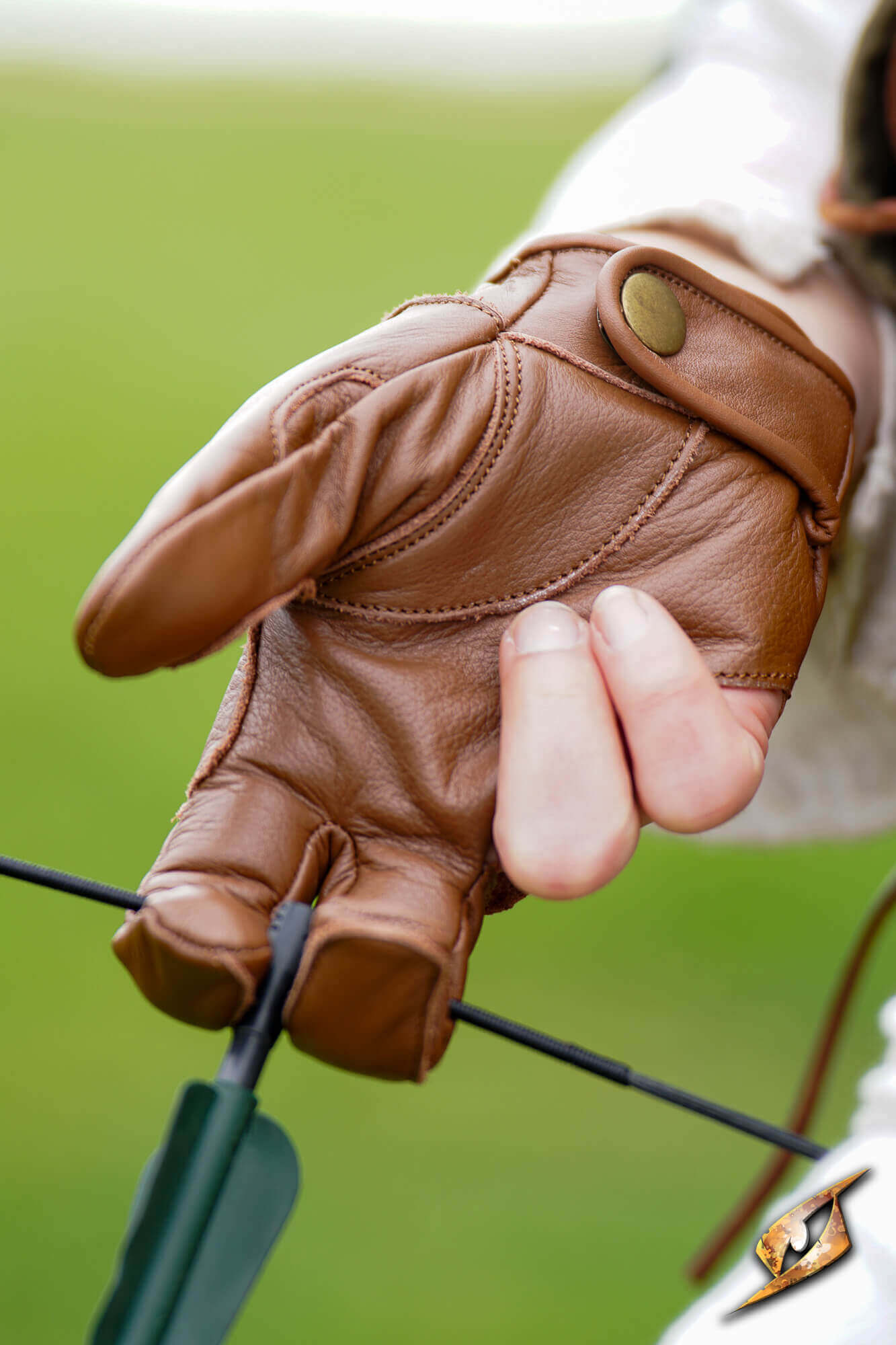 Close-up of a hand wearing an Archery Half-glove, showcasing premium leather and grip for archery.