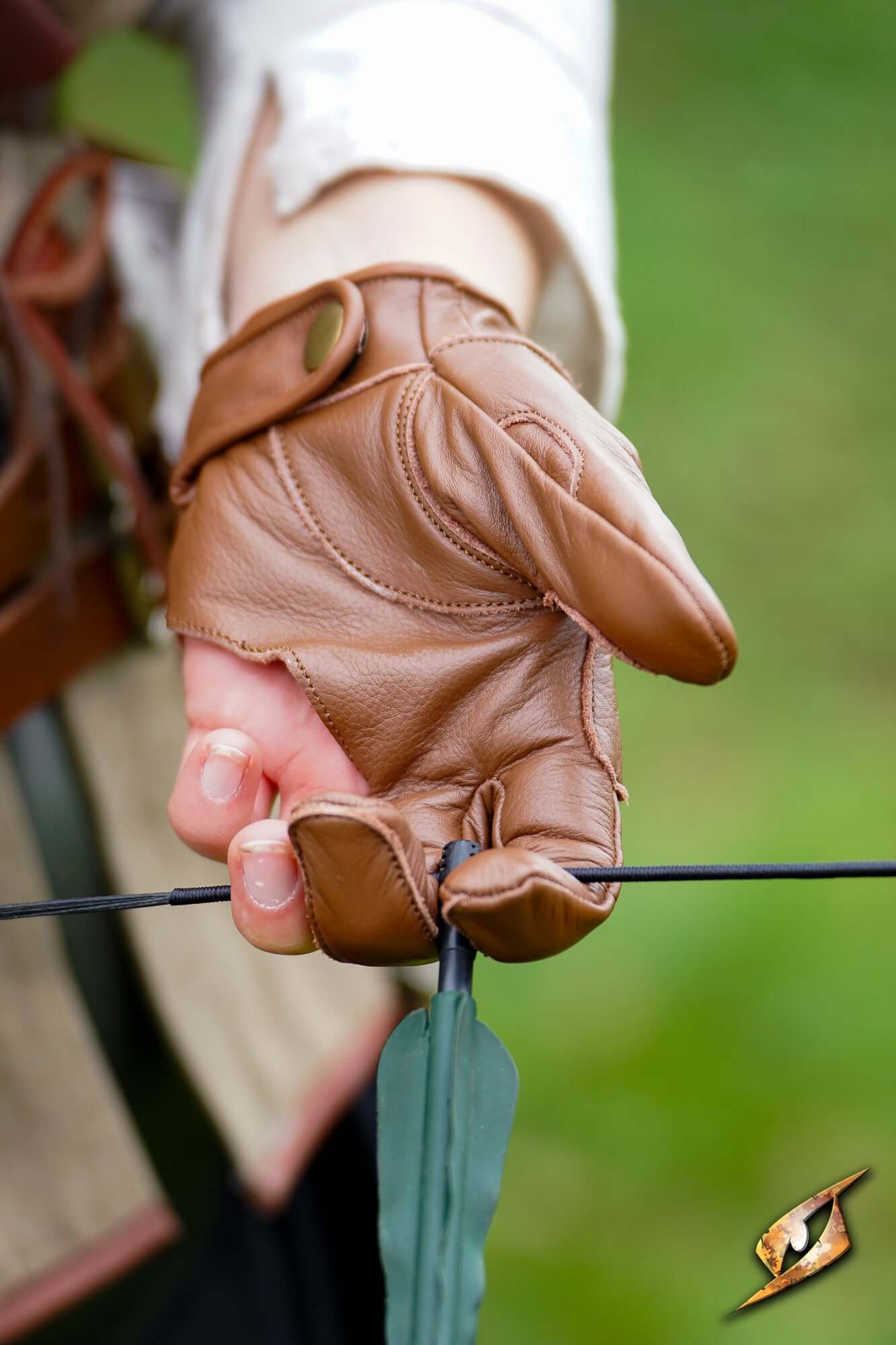 Archery Half-glove worn by an archer preparing to shoot an arrow, offering grip and protection.