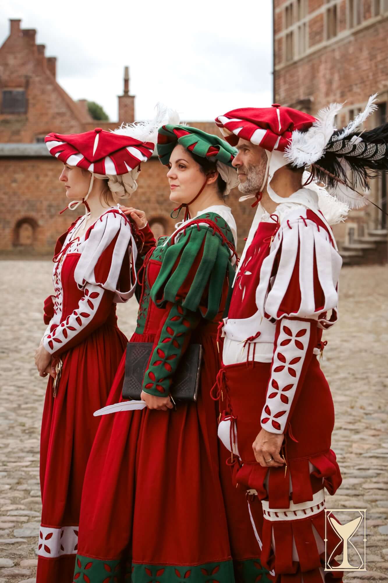 Landsknecht Bloom Sleeve worn by models in traditional attire featuring structured elegance and decorative elements.