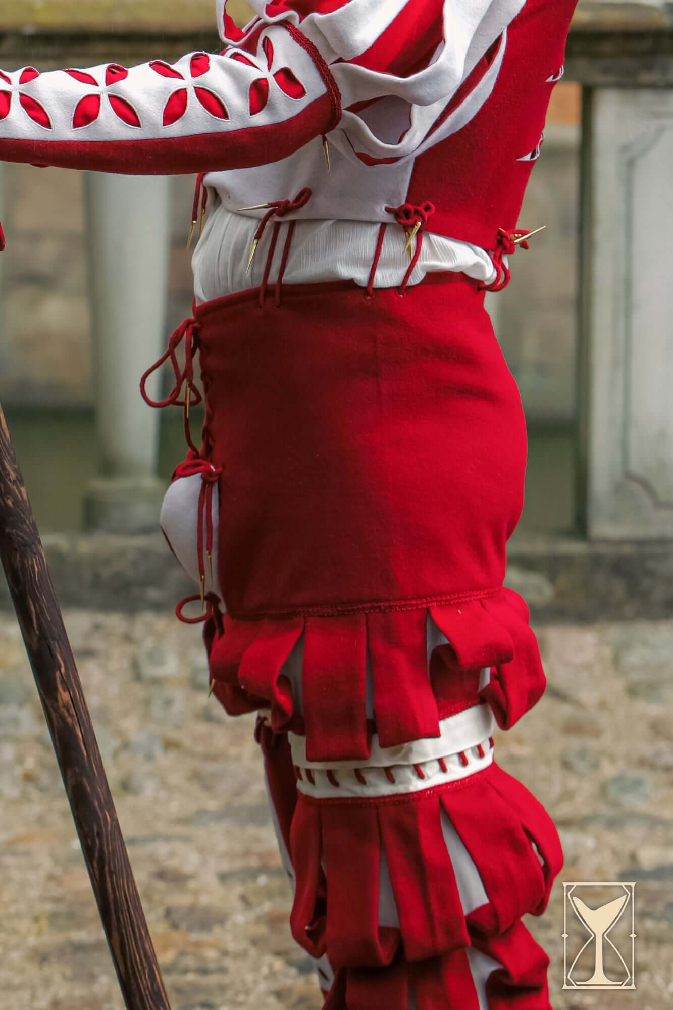 Landsknecht Breeches featuring striking red fabric and dramatic slashes for classic 16th-century mercenary style.