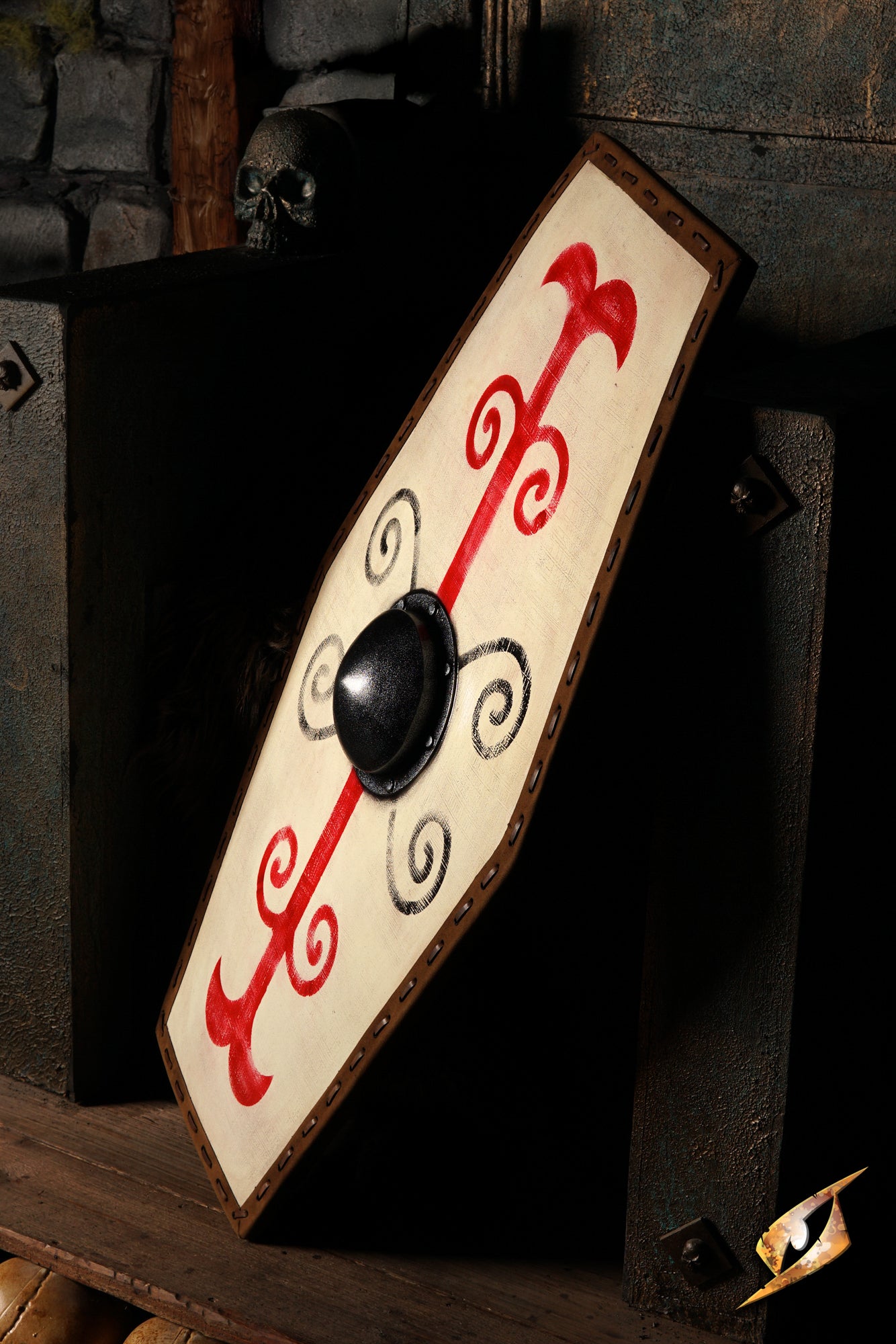 Germanic Shield featuring bold red tribal markings and a domed black boss on a cream face.